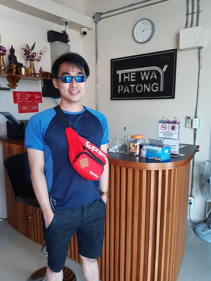 Guest in sunglasses standing at The Way Patong reception