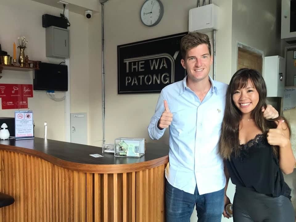 Couple giving a thumbs up at The Way Patong reception