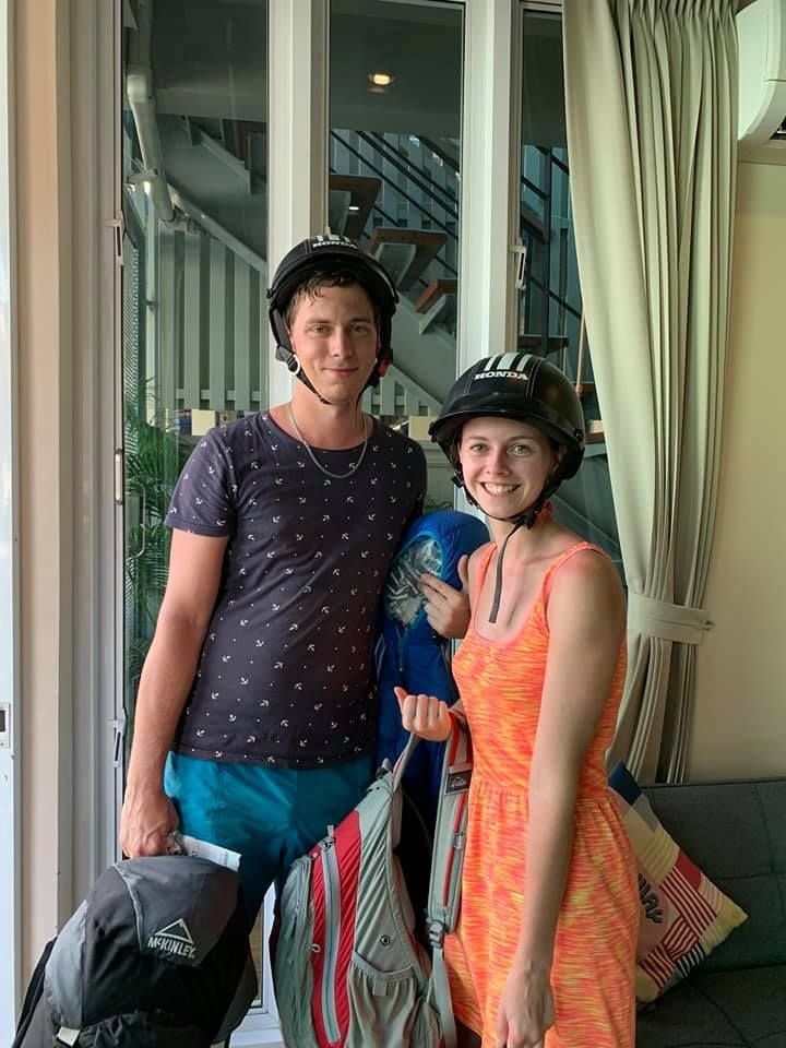 Couple in motorbike helmets in the lobby of The Way Patong Hotel