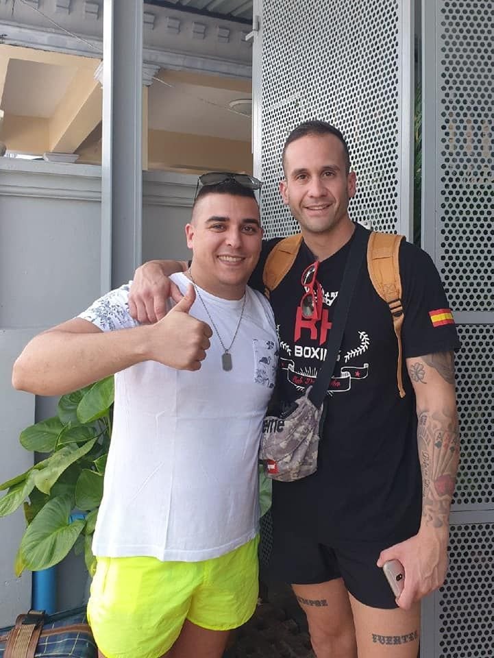 Two friends giving a thumbs up at The Way Patong Hotel