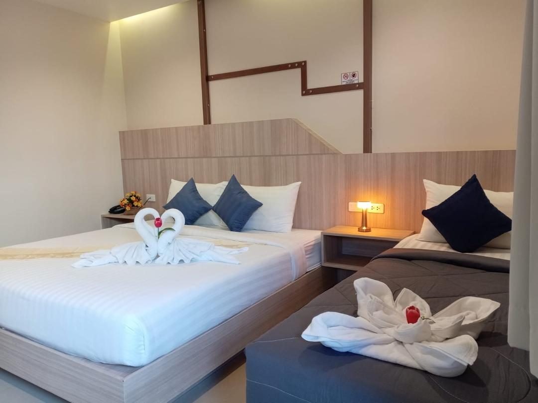 King bed and sofa bed side by side in a 26 m² room at The Way Patong Hotel