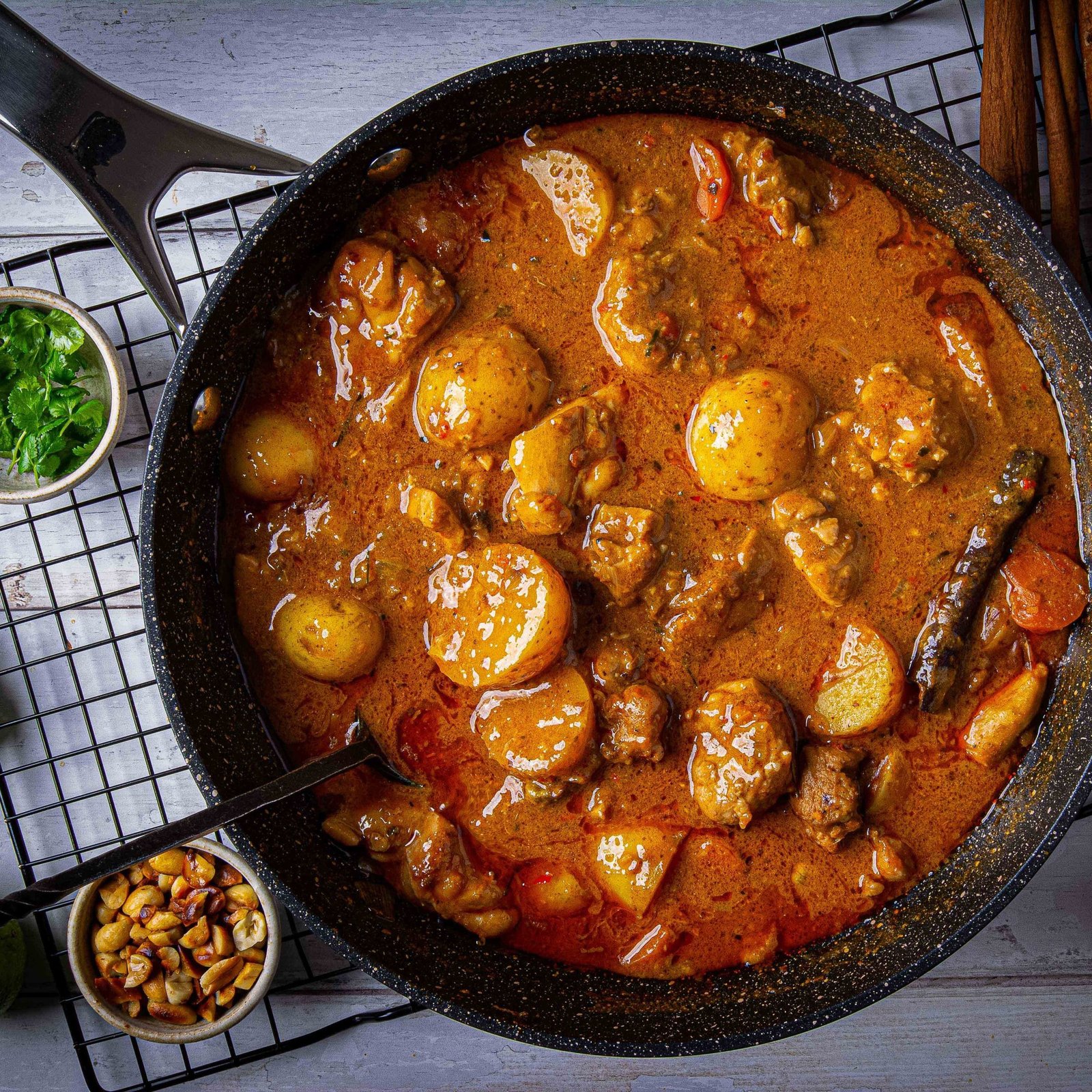 Massaman curry with potatoes in a pan