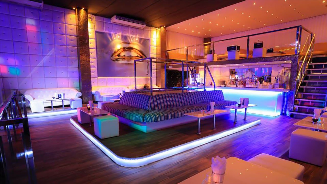 Lounge seating with neon lights at a rooftop bar in Patong