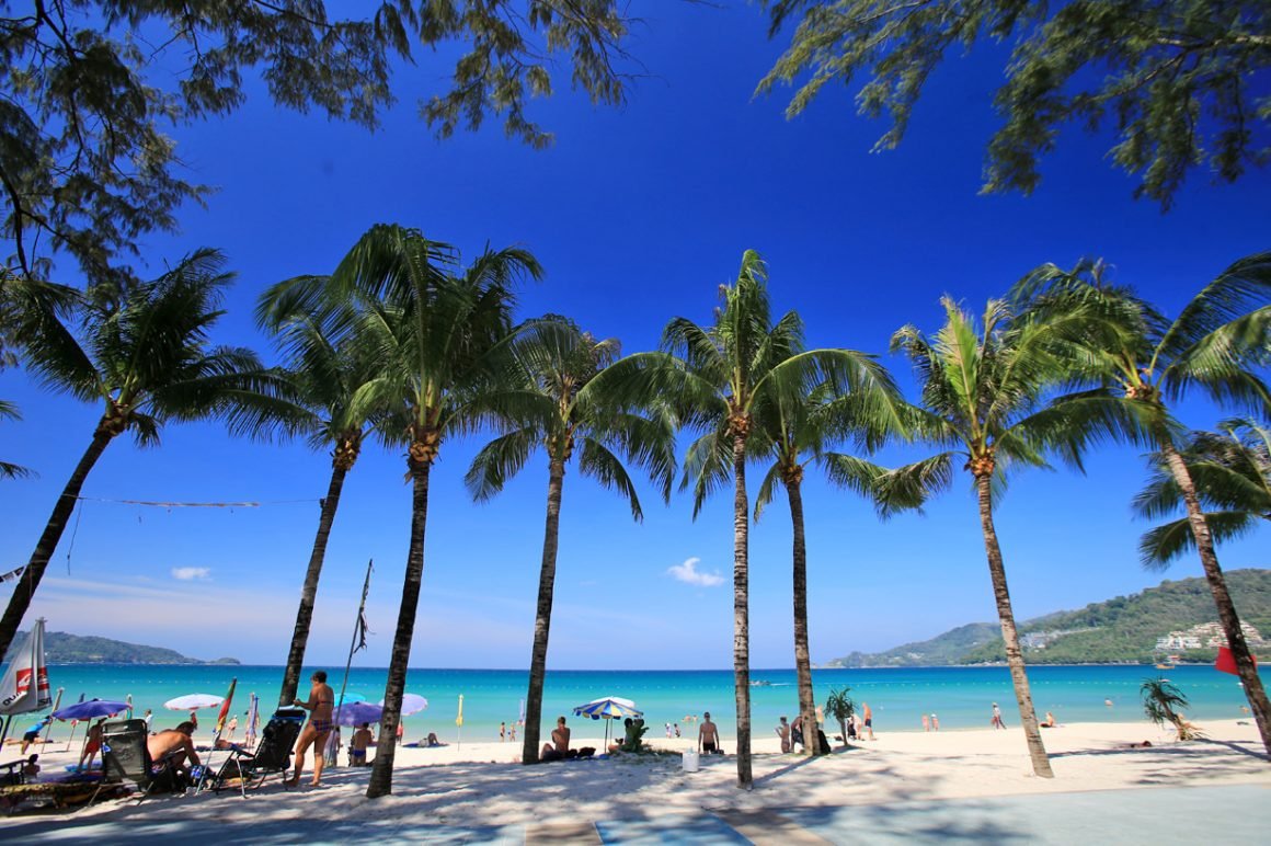 Palm trees and white sand on Patong Beach
