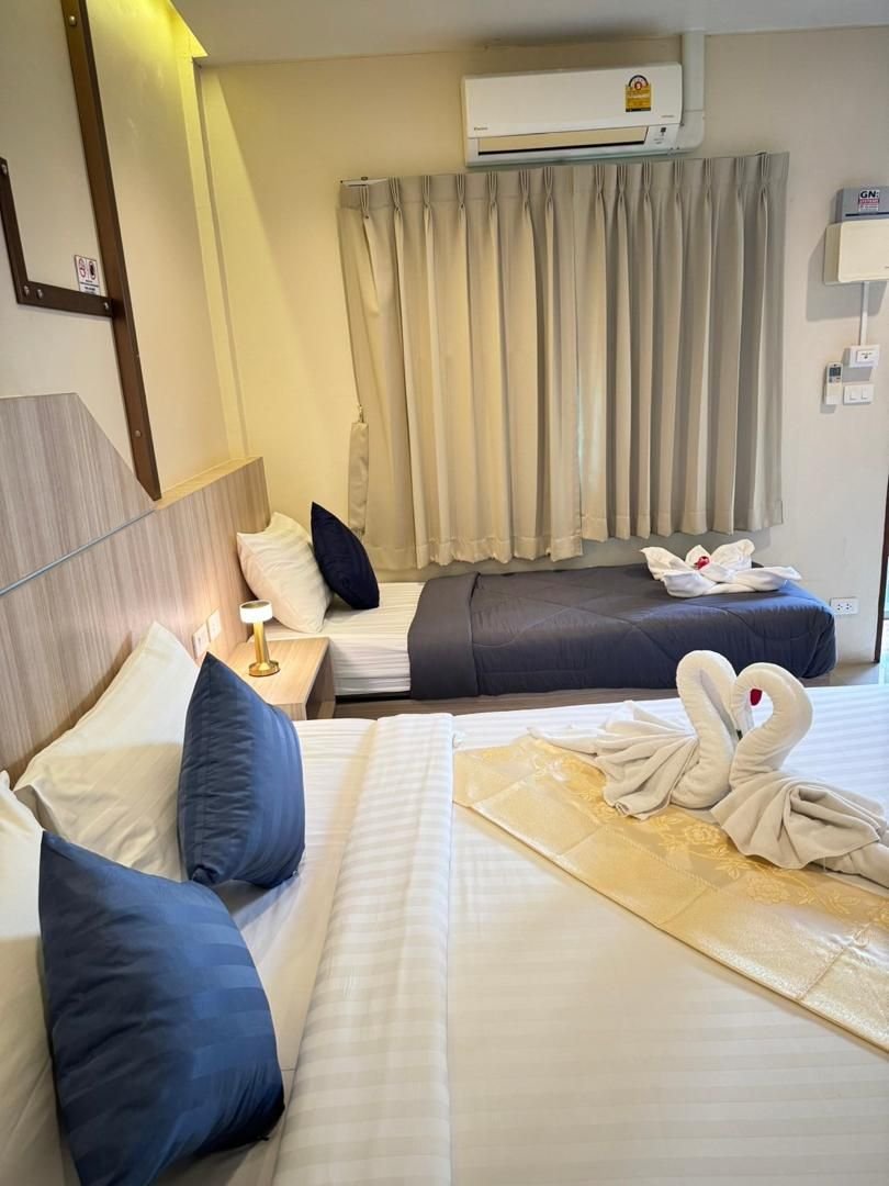 Air-conditioned room with king bed and sofa bed at The Way Patong Hotel