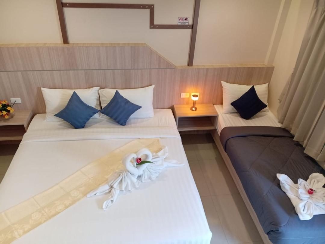Room with king bed and extra sleeping area for a third guest at The Way Patong Hotel