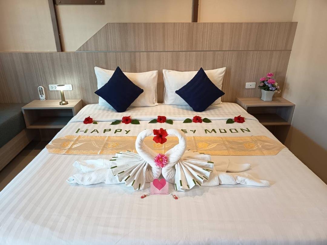 King bed decorated for a honeymoon at The Way Patong Hotel